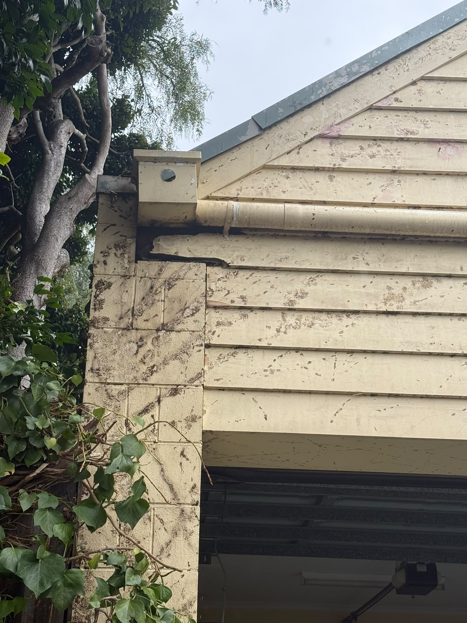 Close view of the Malvern weatherboards and adjoining masonry during exterior preparation